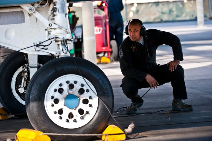 U.S. Air Force Senior Airman Duane Mitchell, 757th Aircraft Maintenance Squadron crew chief, looks underneath an F-15 Eagle during the Mission Employment Phase exercise Dec. 7, 2012, at Nellis Air Force Base, Nev. The exercise incorporates Air Force capabilities in diverse scenarios which can include aircraft in conjunction with space and cyberspace assets. (U.S. Air Force photo/Senior Airman Brett Clashman)