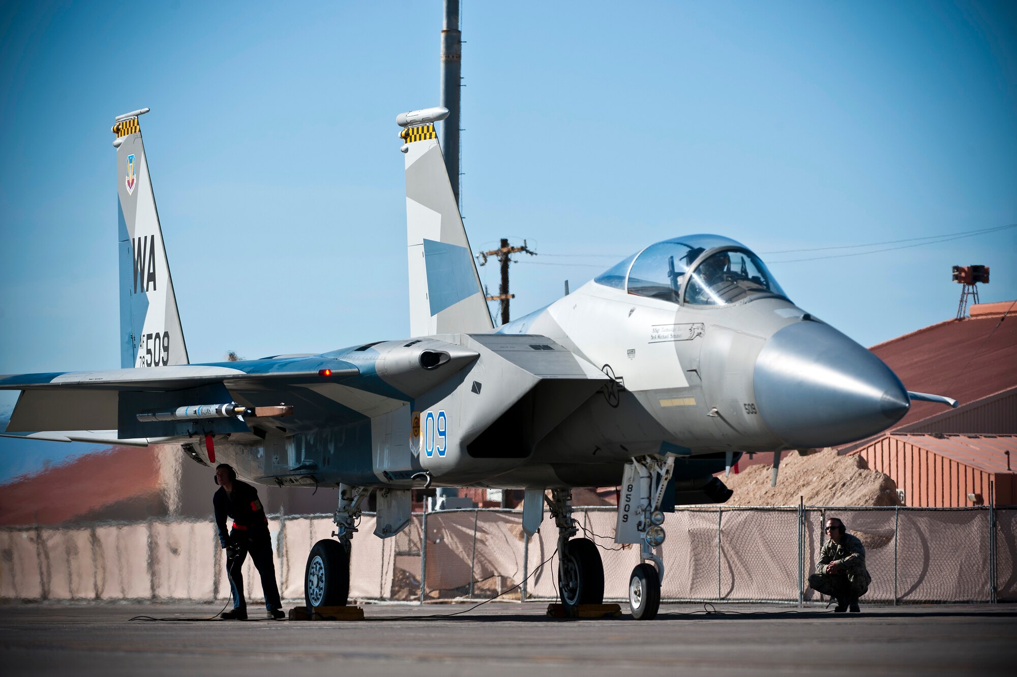 U.S. Air Force Airman 1st Class Jason Kerr and Senior Airman Jeffrey Johnson, 757th Aircraft Maintenance Squadron crew chiefs, conduct pre-flight checks during the Mission Employment Phase exercise Dec. 7, 2012, at Nellis Air Force Base, Nev. The ME Phase is the capstone, graduation exercise conducted by the U.S. Air Force Weapons School. (U.S. Air Force photo/Senior Airman Brett Clashman)