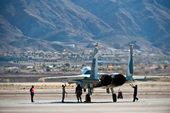 U.S. Air Force crew chiefs from the 757th Aircraft Maintenance Squadron conduct pre-flight checks during the Mission Employment Phase exercise Dec. 7, 2012, at Nellis Air Force Base, Nev. The ME Phase is the capstone, graduation exercise conducted by the U.S. Air Force Weapons School. (U.S. Air Force photo/Senior Airman Brett Clashman)