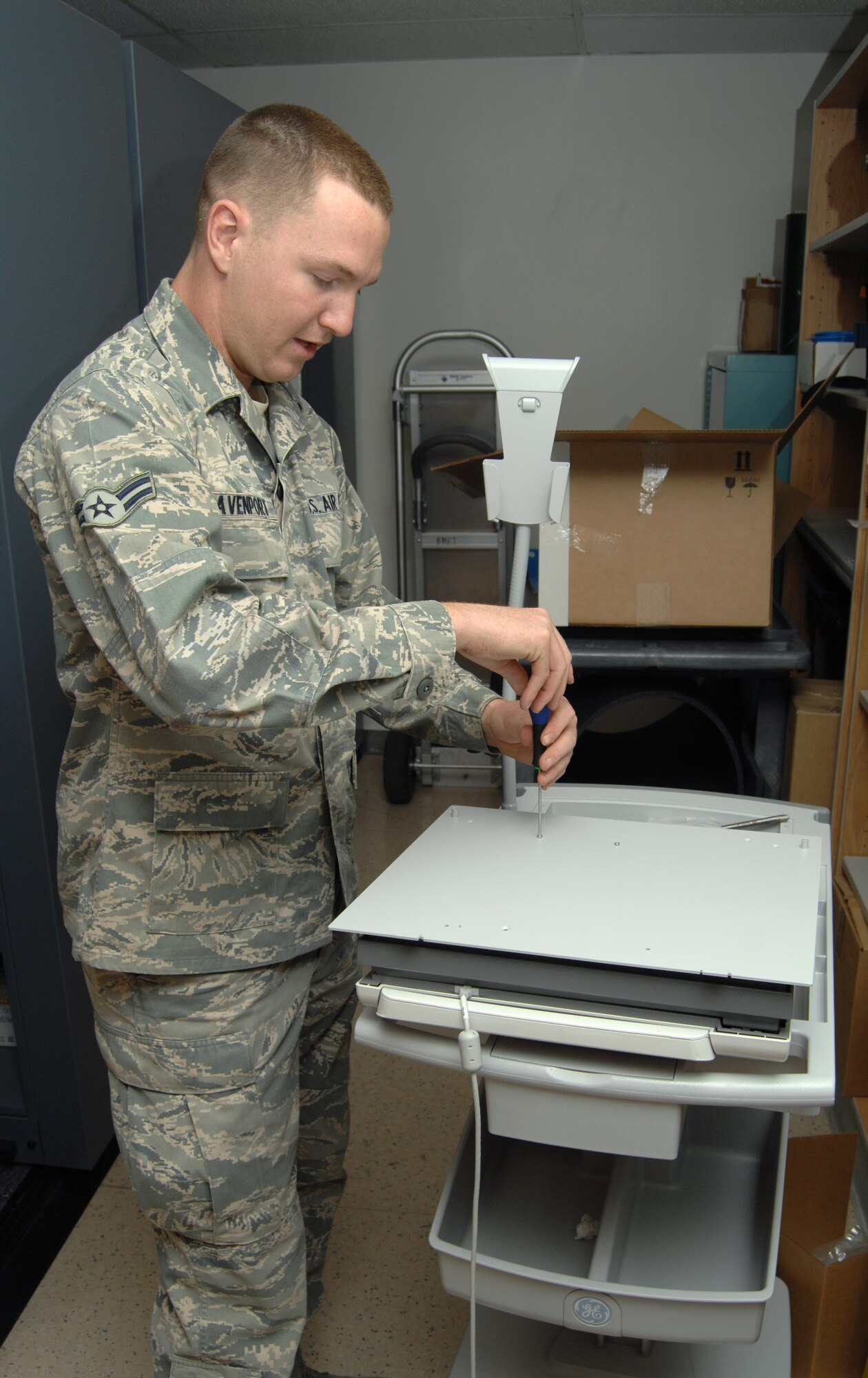 U.S. Air Force Airman 1st Class Austin Davenport, 355th Medical Support Squadron biomedical equipment technician, performs an initial inspection on an ECG machine at Davis-Monthan Air Force Base, Ariz, Nov. 27, 2012. Inspections must be done before the machine can go to the section it belongs to. (U.S. Air Force photo by Senior Airman Michael Washburn/Released)