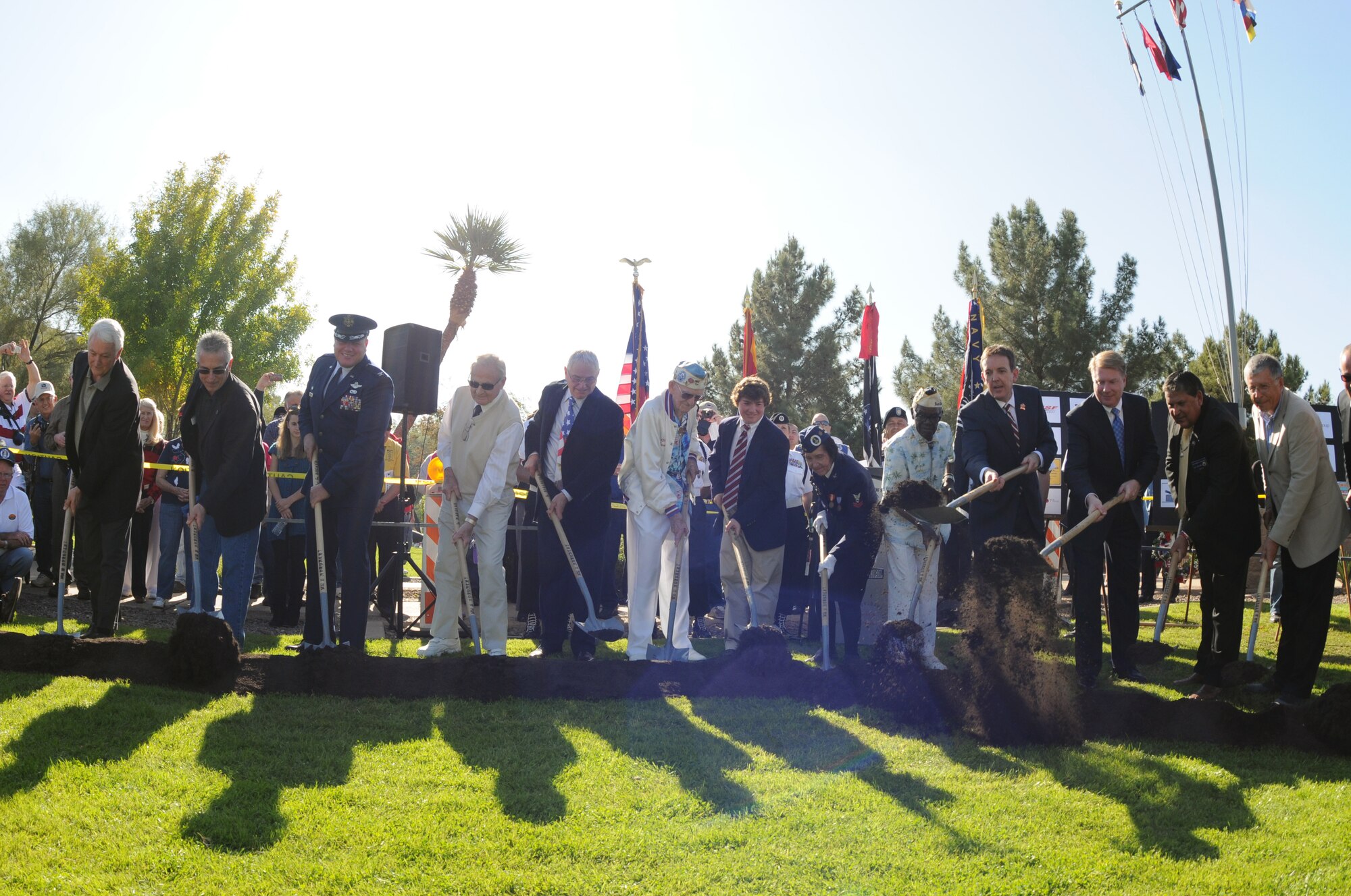 Col. Gary D. Brewer Jr., Commander of 161st Air Refueling Wing, joined Arizona Secretary of State Ken Bennett and other community leaders in the groundbreaking ceremony Dec. 7, 2012, of the Guns to Salute the Fallen World War II Memorial, at Wesley Bolin Memorial Park in Phoenix. (U.S. Air Force photo by Tech. Sgt. Susan Gladstein/Released)