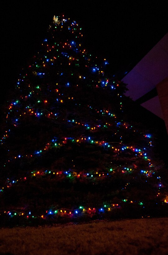 A tree stands lit with Christmas lights after the 28th Bomb Wing Tree Lighting Ceremony in front of the Freedom Chapel on Ellsworth Air Force Base, S.D, Dec. 5, 2012. The evening kicked off with a speech from Col. Mark Weatherington, 28th BW commander, a surprise appearance from Santa Claus and Rudolf, holiday music by the children’s choir and refreshments for all who attended the ceremony. (U.S. Air Force photo by Airman 1st Class Kate Thornton-Maurer/Released)