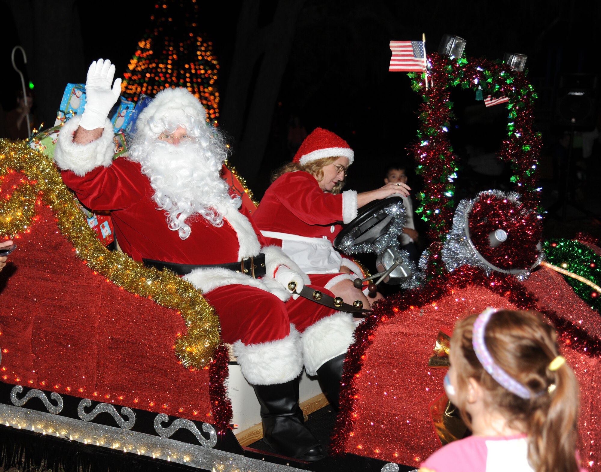 Petty Officer 1st Class Mike DeMauro, Center for Naval Aviation Technical Training Unit, his daughter, Evelyn, 7; wife, Clarissa, and son, Hayden, 4, admire the Christmas light decorations at  Keesler’s annual Holiday in the Park, Dec. 6, 2012, at marina park, Keesler Air Force Base, Miss. The event included a tree lighting ceremony, hay rides, holiday music, visits with Santa and free food and beverages.  (U.S. Air Force photo by Kemberly Groue)