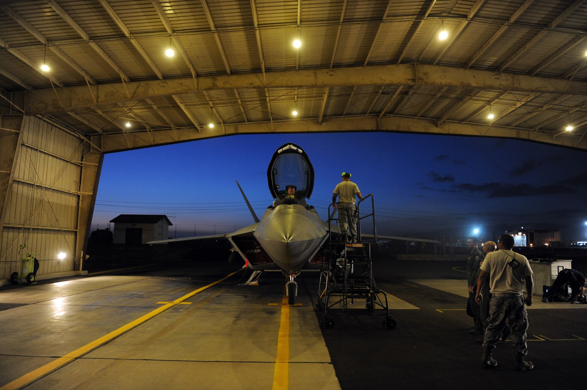 An F-22 Raptor piloted by Lt. Col. Mark Ladtkow, 199th Fighter Squadron commander, is taxied in to the "Alert Pad Dec. 6 at Joint Base Pearl Harbor-Hickam, Hawaii. The active duty 19th Fighter Squadron, in partnership with the Hawaii Air National Guard's 199th FS, took over the Aerospace Control Alert mission from the Montana Air National Guard, who have operated the mission for the past two years during a transition from the F-15 Eagle to the F-22. (U.S. Air Force photo by Staff Sgt. Nathan Allen)