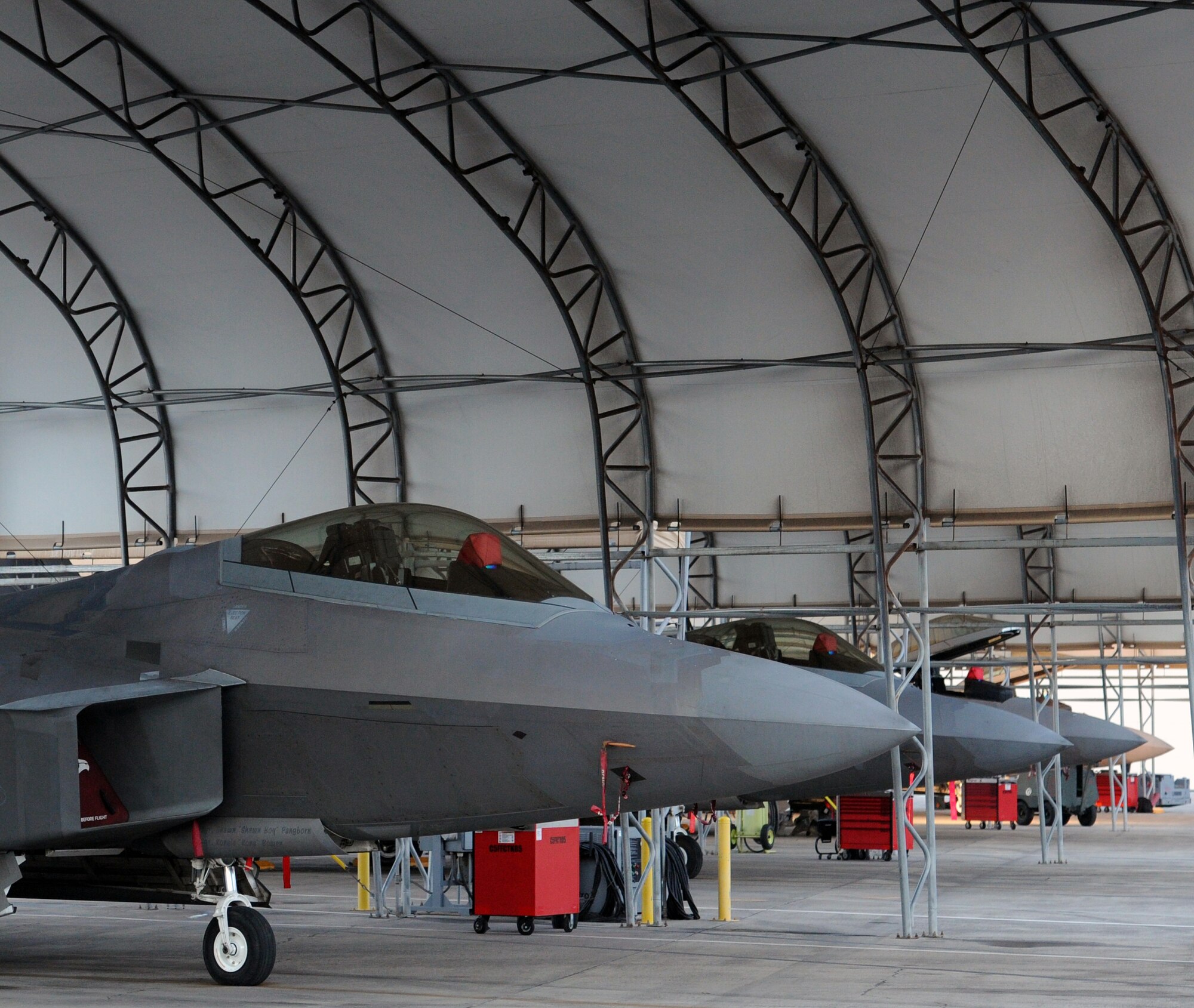 An F-22 Raptor taxis to the "Alert Pad" Dec. 6 at Joint Base Pearl Harbor-Hickam, Hawaii. The active duty 19th Fighter Squadron, in partnership with the Hawaii Air National Guard's 199th Fighter Squadron, took over the Aerospace Control Alert mission from the Montana Air National Guard, who have operated the mission for the past two years during a transition from the F-15 Eagle to the F-22. (U.S. Air Force photo by Staff Sgt. Nathan Allen)
