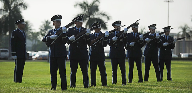 Honor guardsmen perform a "three-volley salute" Dec. 7 at Joint Base Pearl Harbor-Hickam, Hawaii, during the 71st Anniversary Remembrance Ceremony honoring the attacks on Hickam field Dec. 7, 1941. Seventy-one years ago, Japanese air and naval forces launched a surprise attack on U.S. military forces throughout Oahu. The attacks hit several installations on the island with the aim of crippling the U.S. fleet to prevent interference with Japanese military plans in the Pacific theater.  (U.S. Air Force photo/Senior Airman Lauren Main)