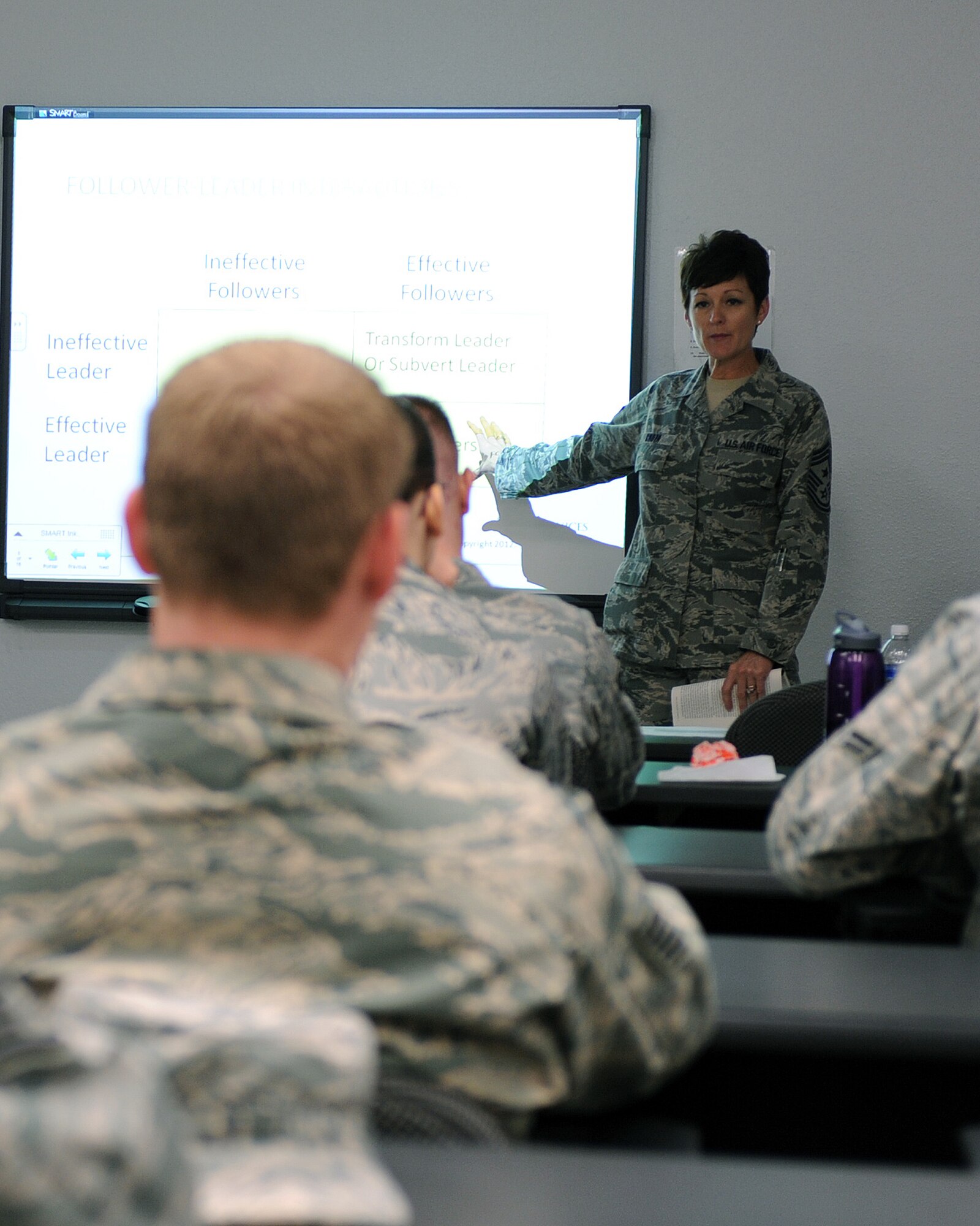 U.S. Air Force Chief Master Sergeant Dawna Cnota, 355th Fighter Wing command
chief briefs D-M Airmen the importance of being a good follower at the
Kennedy Professional Development Center  Dec. 5, 2012. CMSgt Cnota shared an
interesting fact: there are 19,406 books about leadership, but only four
about followership. (U.S. Air Force photo by Airman 1st Class Christine
Griffiths/Released)