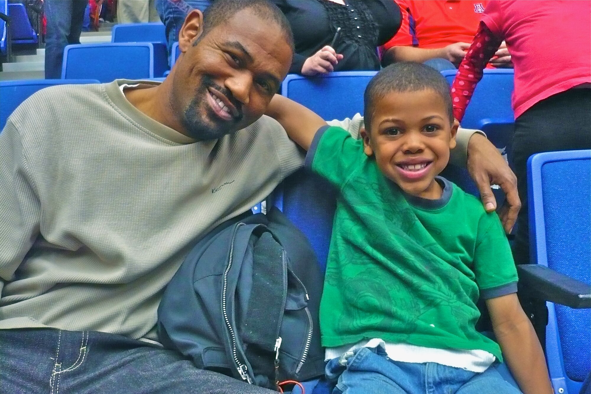 A big and his little enjoy a basketball game at the University of Arizona. (Courtesy photo)