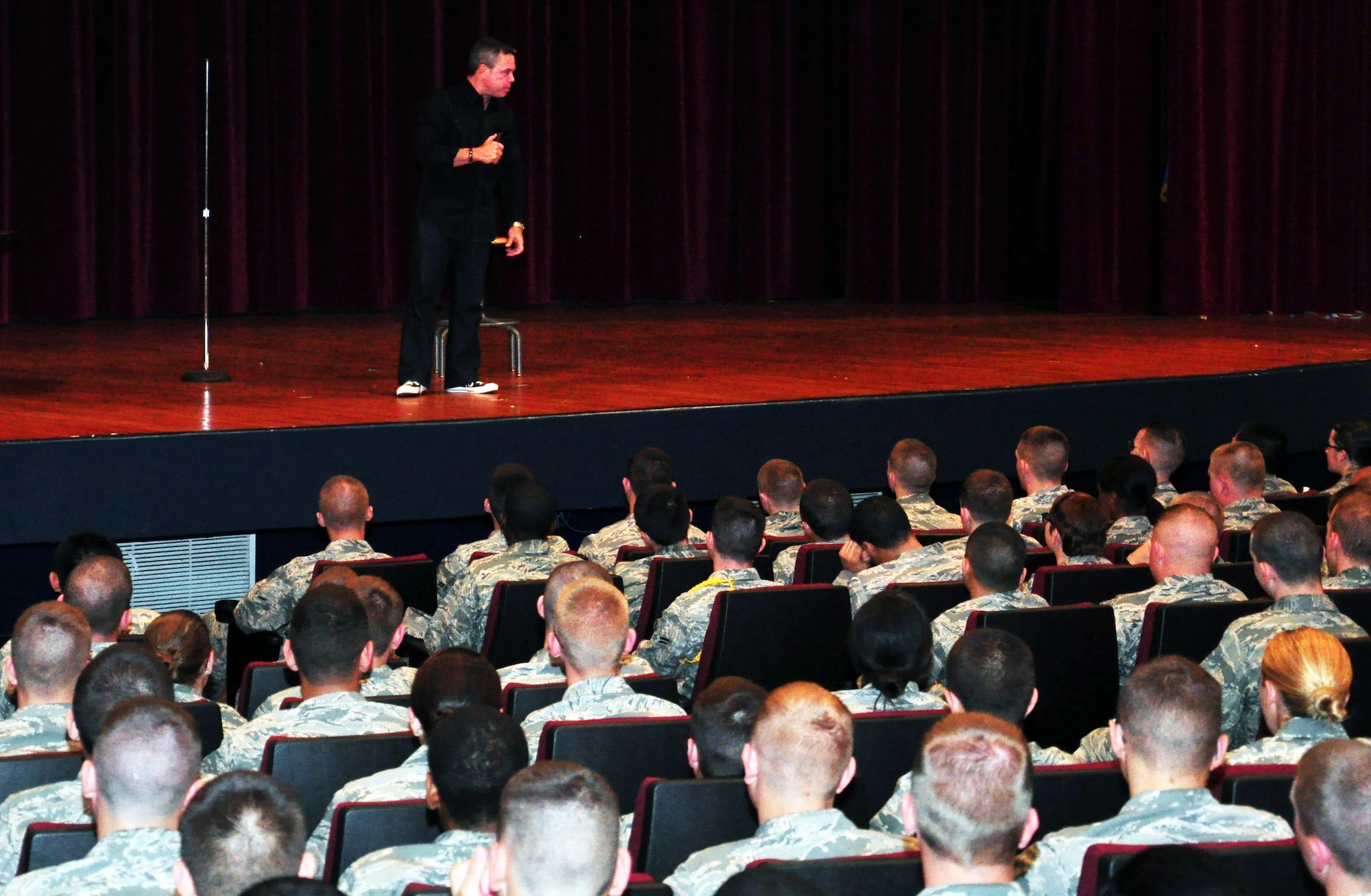 Comedian Bernie McGrenahan entertains and educates Airmen on December 7.  McGrenahan used comedy to educate people on the dangers of "high risk" conduct and the consequences that may result from such behavior.  (US Air Force Photo/Josh Wilson)