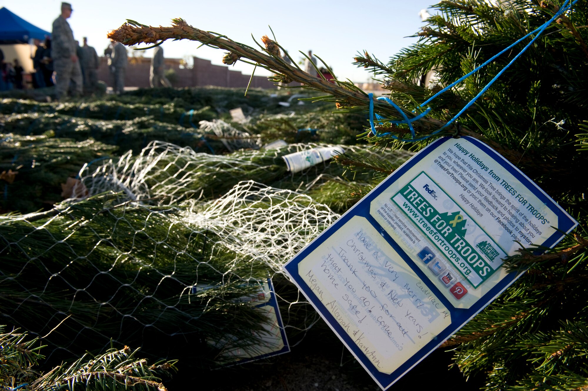 A card displays a personalized holiday message during the Trees for Troops event Dec. 7, 2012, at Nellis Air Force Base, Nev. A holiday message from individuals who donated to the program is attached to every tree. (U.S. Air Force photo by Senior Airman Matthew Lancaster)