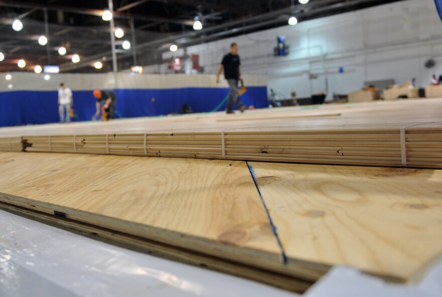 Workers have begun constructing the new basketball court at the Offutt Field House at Offutt Air Force Base, Neb., Dec. 6. The field house is currently undergoing renovations to improve the basketball courts and soccer field. (U.S. Air Force photo by Jeff W. Gates/Released)