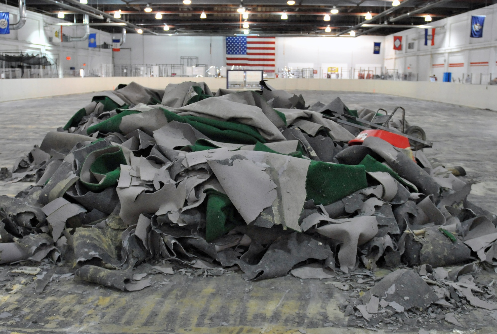 Demolition efforts have begun on the soccer field in the Offutt Field House at Offutt Air Force Base, Neb., Dec. 6. The field house is currently undergoing major renovations to improve the basketball courts and soccer field. One basketball court is complete as another is being renovated currently along with the nearby soccer field turf. (U.S. Air Force photo by Jeff W. Gates/Released)