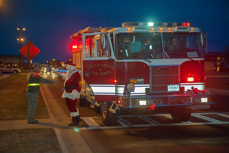 Col. Robert Stanley, 341st Missile Wing vice commander, greets Santa Claus at the tree lighting ceremony at the Grizzly Bend on Nov. 29.  The ceremony kicked off Malmstrom’s winter holiday celebrations.  (U.S. Air Force photo/Beau Wade)