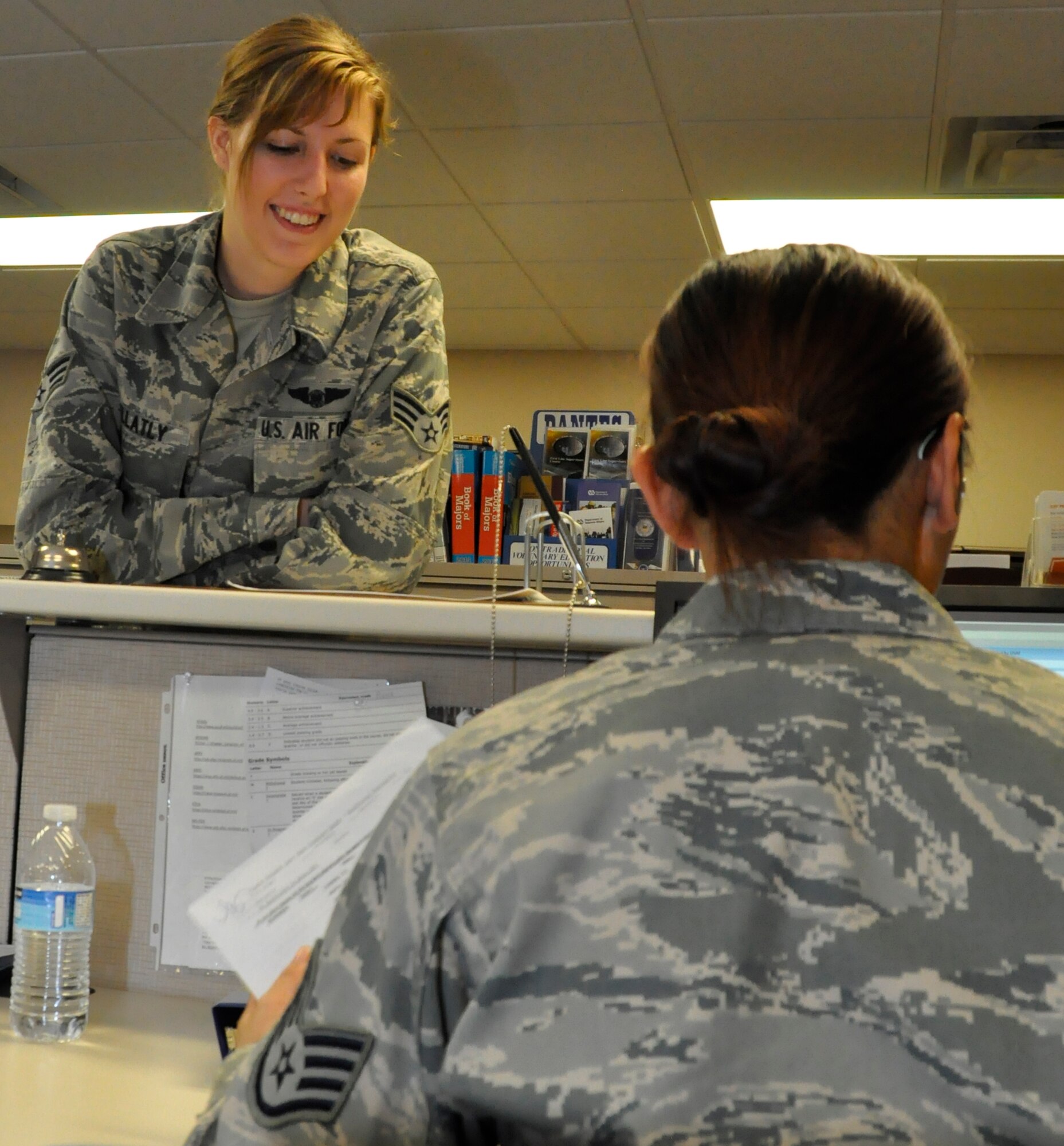 Senior Airman Gloria Gellatly, a Reservist with the 446th Aeromedical Evacuation Squadron at McChord Field, speaks with Staff Sgt. Chustine Minoda, an education and training apprentice with the 446th Force Support Squadron, about college classes she's taking Dec. 1. The Education and Training Flight regularly counsels 446th Airlift Wing Reservists on their benefits. (U.S. Air Force photo/Staff Sgt. Rachael Garneau)