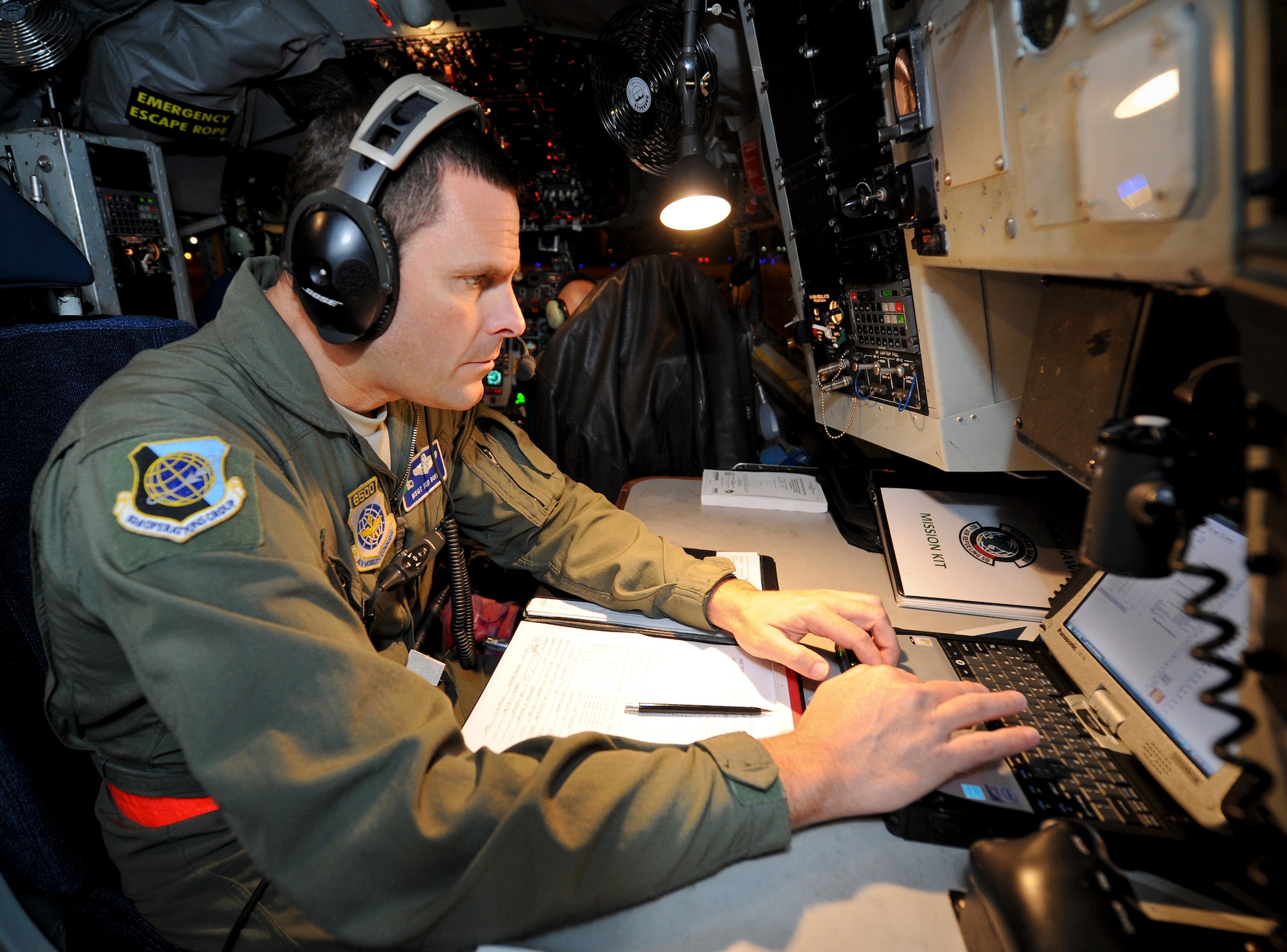 Master Sgt. Ted Buit prepares for an upcoming night operation inside the cockpit of a KC-135 Stratotanker at Fairchild Air Force Base, Wash., Nov. 15, 2012. Buit is the 92nd Operations Group standards evaluations NCO in charge and career boom operator. On this flight he surpassed 7,500 mishap free flying hours. (U.S. Air Force photo/Senior Airman Benjamin Stratton)
