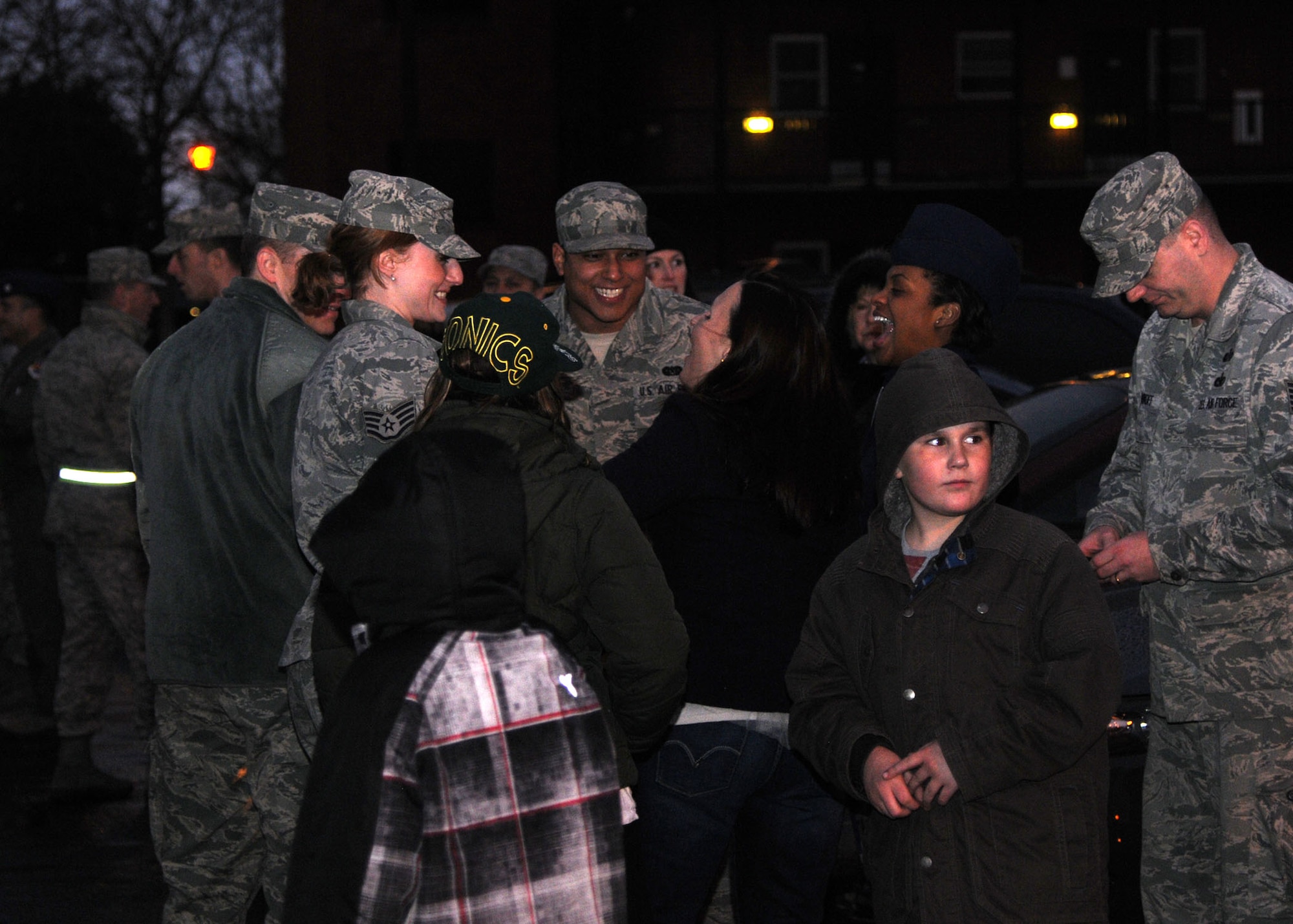 Members of Team Mildenhall watch the annual Christmas tree lighting ceremony Dec. 7, 2012, at RAF Mildenhall, England. The event, hosted by Col. Christopher Kulas, 100th Air Refueling Wing commander, celebrated the beginning of the holiday season for RAF Mildenhall. (U.S. Air Force photo by Airman 1st Class Kelsey Waters/Released) 