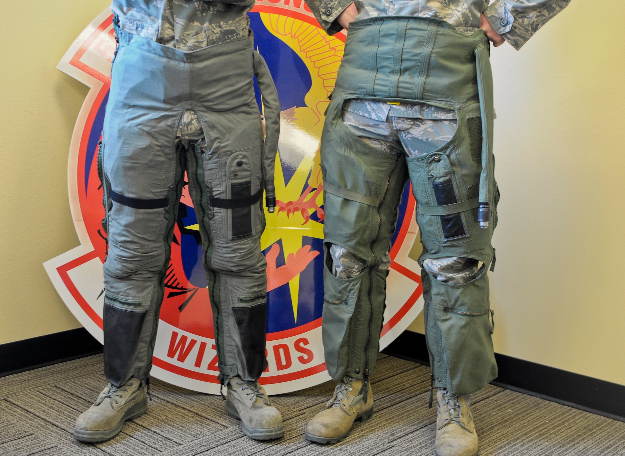 The new full coverage anti-G-suit, left, is the same one used by pilots flying the F-22 and F-35. The current G-suit being used by most pilots at Luke was designed in the ’40s. (U.S. Air Force photo by Staff Sgt. C.J. Hatch)