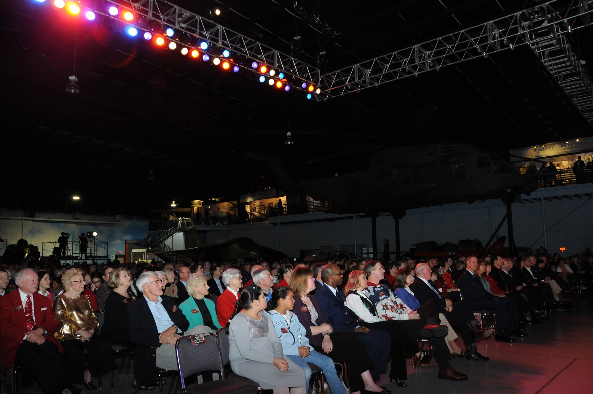 An overflow crowd enjoys the Band of the U.S. Air Force Reserve performance during the 51st Annual Holiday Concert at the Museum of Aviation at Robins Air Force Base, Dec. 6 (U.S. Air Force photo/Senior Airman Katie Spencer)