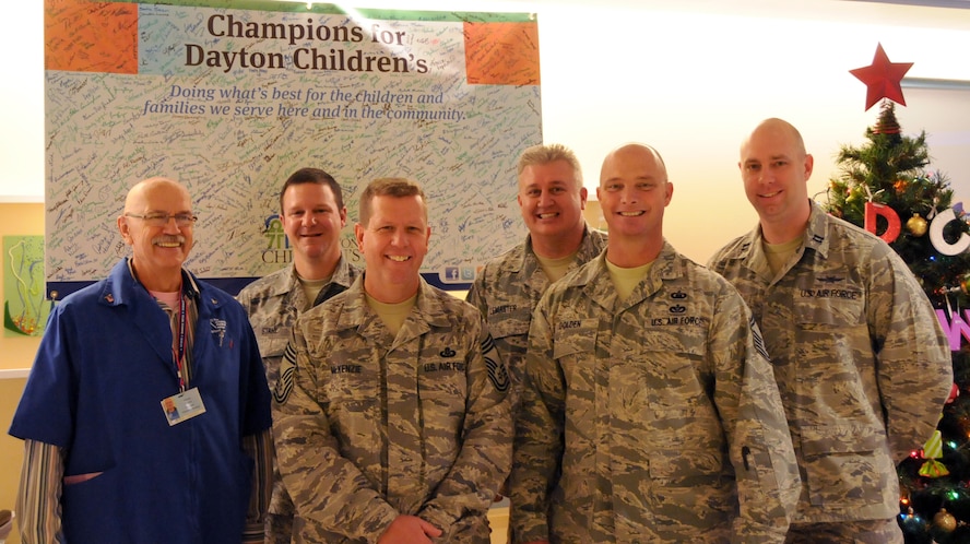 Members of the 178th Fighter Wing visit Children's Medical Center, Dayton, Ohio Dec. 6 to visit with children and their families in the hospital and give them a stuffed animal. The stuffed animals were provided by the 178th Fighter Wing Company Grade Officers Club.