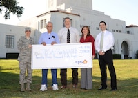 Randolph and CPS Energy representatives hold a mock check representing a $23,048 credit on Randolph's utility bill, the result of the installation's participation in CPS Energy's Demand Response Program this summer. From left are Col. Christine Erlewine, 902nd Mission Support Group commander; Luis Medina, 902nd Civil Engineer Squadron Energy Management Control System; Bruce Dschuden, JBSA resource efficiency manager; Yvonne Haecker, CPSE energy solutions manager; and Ruben Ramos, 902nd CES energy manager.

(Courtesy photo)