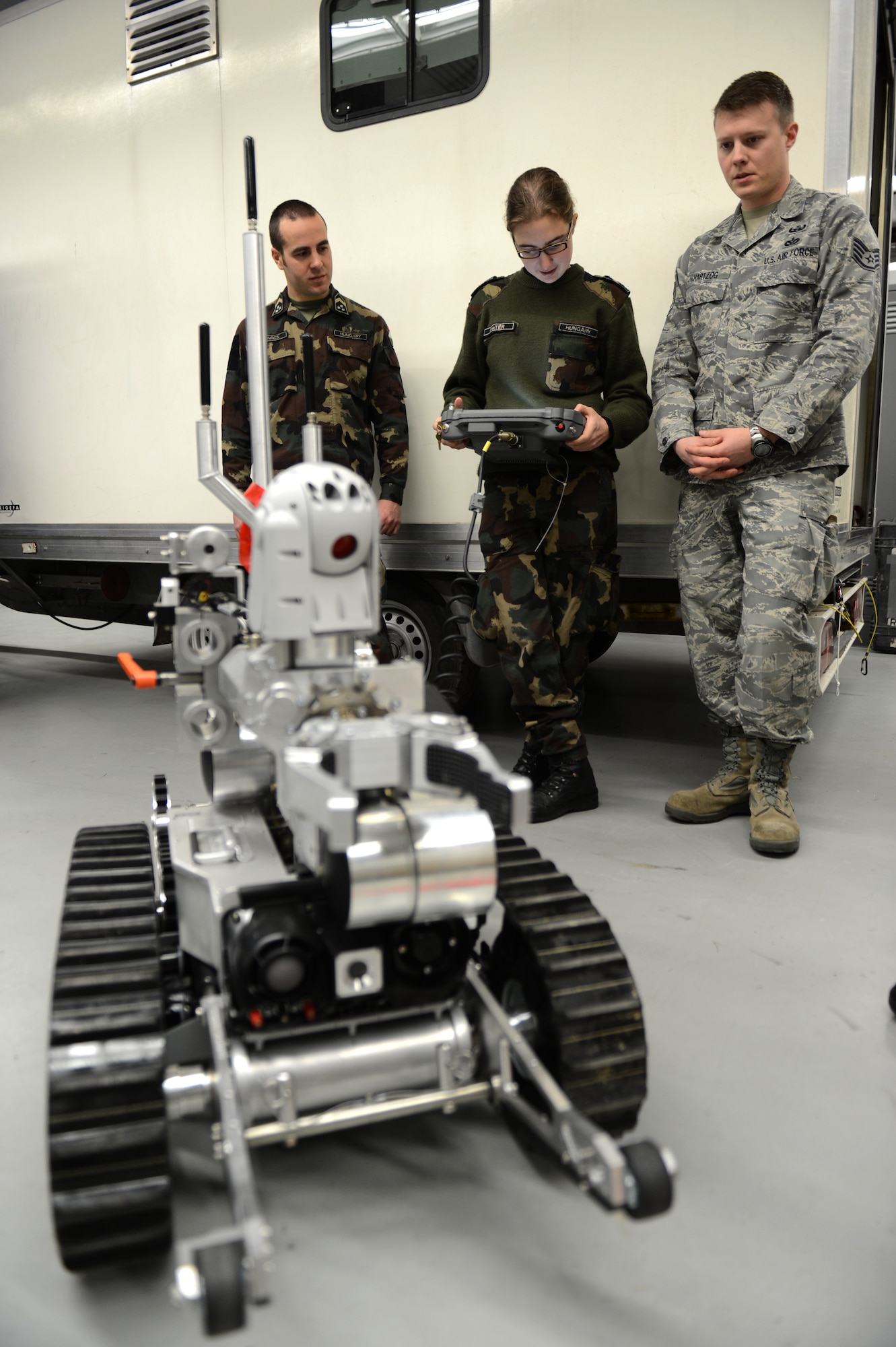 SPANGDAHLEM AIR BASE, Germany – Hungarian army Sgt. Agnes Pinter, Hungarian Defense Force NCO Academy counter IED instructor, controls a Remotec HD-2 remote control military robot at the 52nd Civil Engineer Squadron Explosive Ordnance Disposal shop Dec. 4, 2012. Hungarian army members visited Spangdahlem Air Base to join forces in teaching information on the most current threats in contingency operations across the globe. EOD Airmen try to host multinational training as much as possible, but this is their first time working with the Hungarian Army. (U.S. Air Force photo by Airman 1st Class Gustavo Castillo/Released)