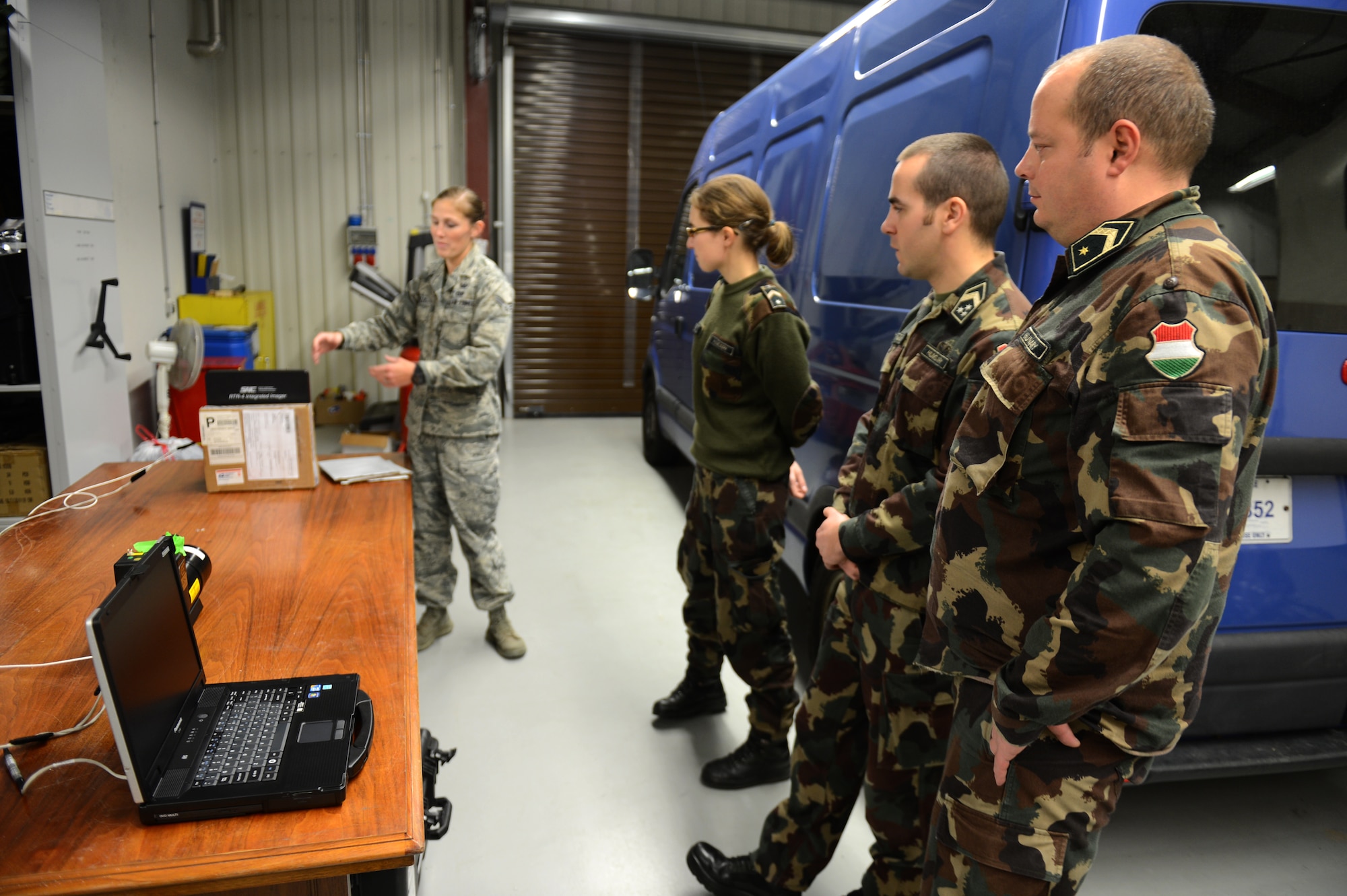 SPANGDAHLEM AIR BASE, Germany – Members of the Hungarian army learn about an XRS-3 X-ray kit at the 52nd Civil Engineer Squadron Explosive Ordnance Disposal shop Dec. 4, 2012. Hungarian army members visited Spangdahlem AB to join forces in teaching information on the most current threats in contingency operations across the globe. The X-ray kit is a primary piece of equipment for counter improvised-explosive-device operations. (U.S. Air Force photo by Airman 1st Class Gustavo Castillo/Released)