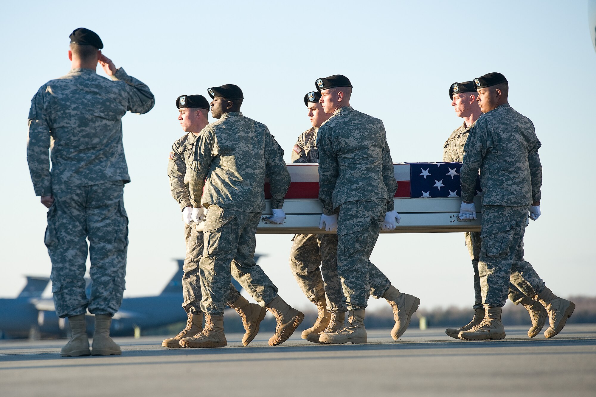 A U.S. Army carry team transfers the remains of Army Spc. Tyler J. Orgaard, of Bismark, N.D., at Dover Air Force Base, Del., Dec. 5, 2012. Orgaard was assigned to the 818th Engineer Company, 164th Engineer Battalion, Williston, N.D. (U.S. Air Force photo/Greg L. Davis)