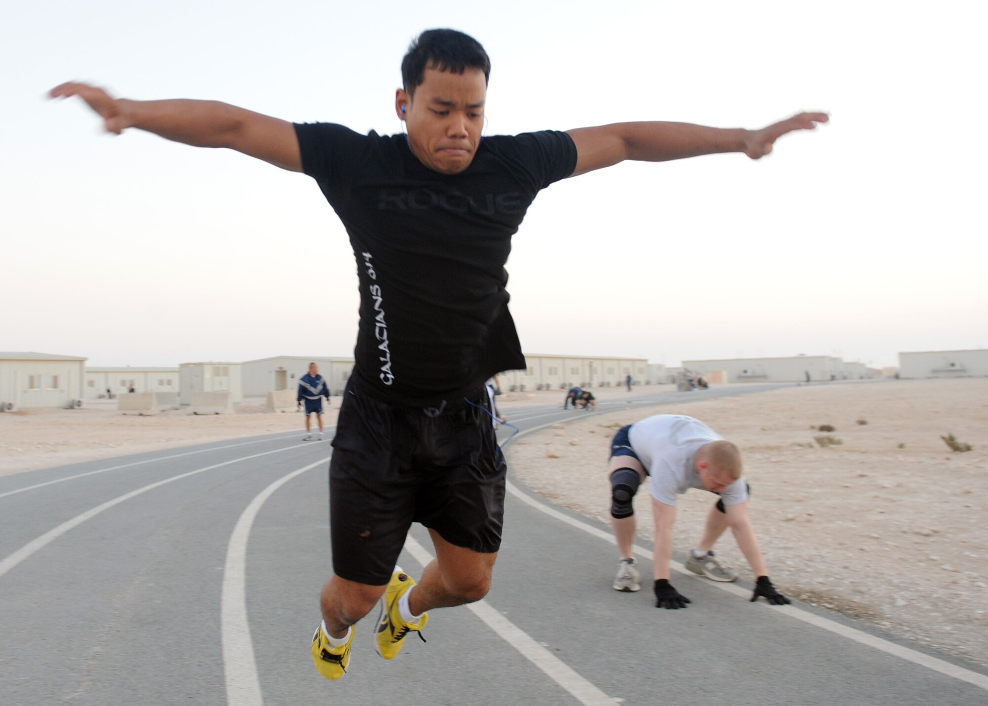 SOUTHWEST ASIA – Staff Sgt. Minh Thlang, 379th Expeditionary Civil Engineer Squadron, takes the 609th Air Communications Squadron Detachment 1’s challenge to participate in the extreme burpee challenge Dec. 1. The 609th ACOMS opened up their fitness challenge to everyone in the 379th Air Expeditionary Wing.  (U.S. Air Force photo/Senior Airman Joel Mease)