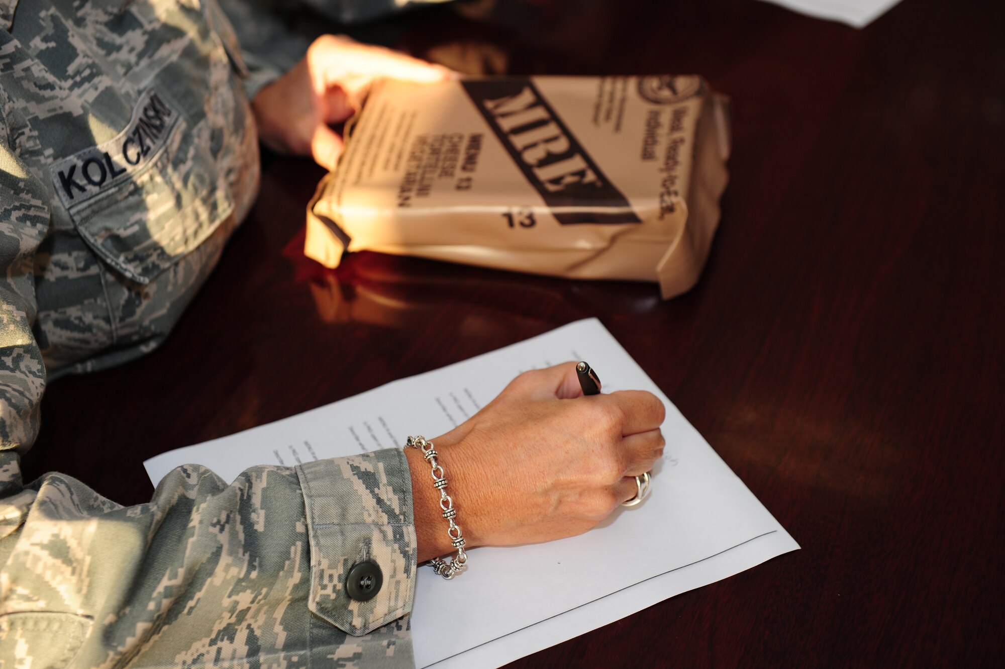 SOUTHWEST ASIA -- Senior Master Sgt Dawn Kolczinski, a 379th Expeditionary Medical Group bioenvironmental engineering technician, fills out a Meals Ready to Eat inspection form during Operation: Chowdown. Chowdown is the quarterly inspection of random lots of MREs that insures the vital supplies are still good for use by coalition forces throughout Southwest Asia.  (U.S. Air Force photo/ Master Sgt Brendan Kavanaugh)
