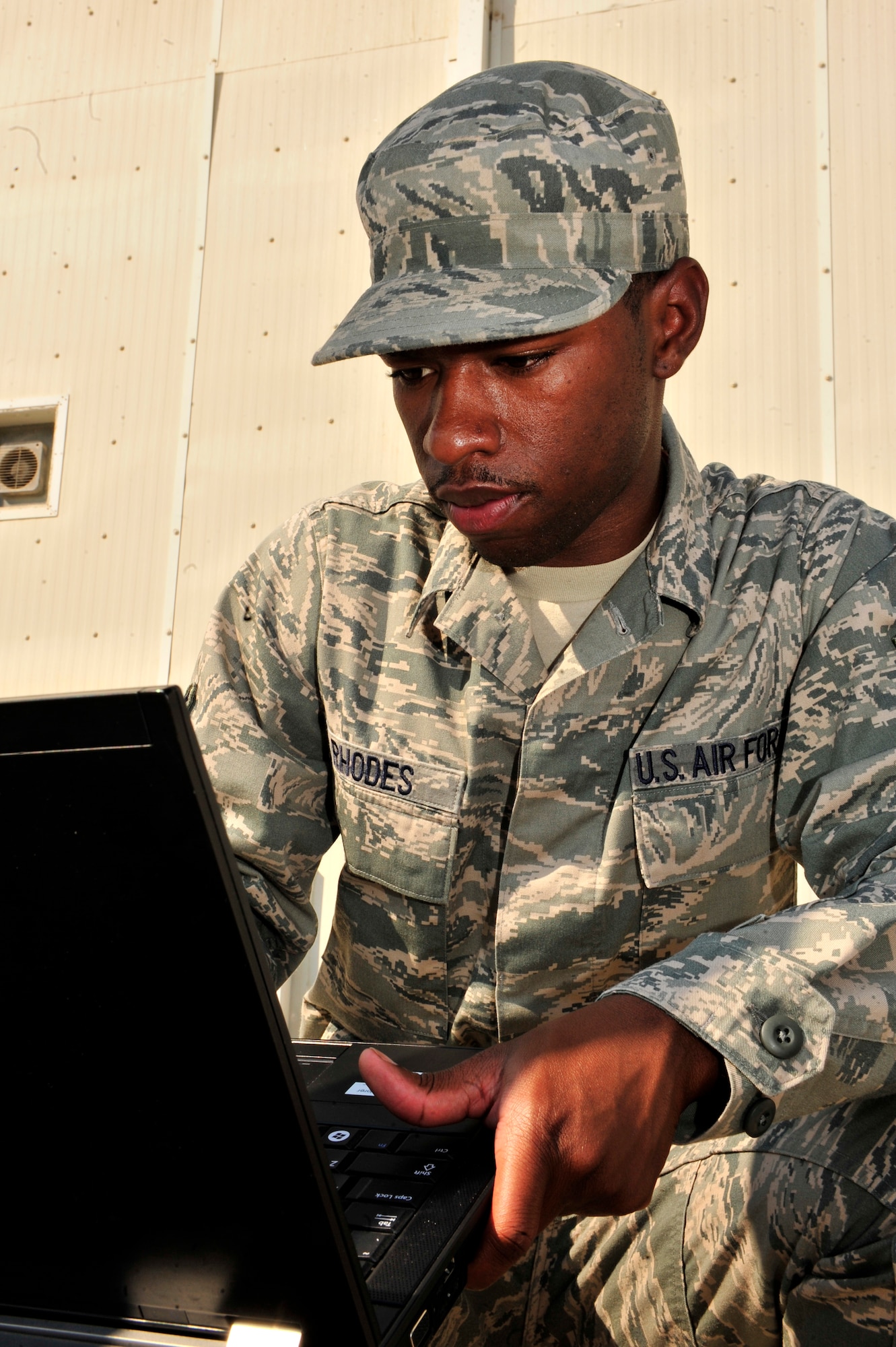 SOUTHWEST ASIA -- U.S. Air Force Senior Airman Garrett Rhodes, 380th Expeditionary Communications Squadron radio frequency transmissions system journeyman, configures the Communications Fly-Away Kit (CFK) Nov. 3, 2012. Rhodes is responsible for ensuring the Non-Secure Internet Protocol Router, Secure Internet Protocol Router, and Voice Over Secure Internet Protocol is operational within 30 minutes during emergencies and contingency operations. (U.S. Air Force photo/Tech. Sgt. Christina M. Styer) (RELEASED)