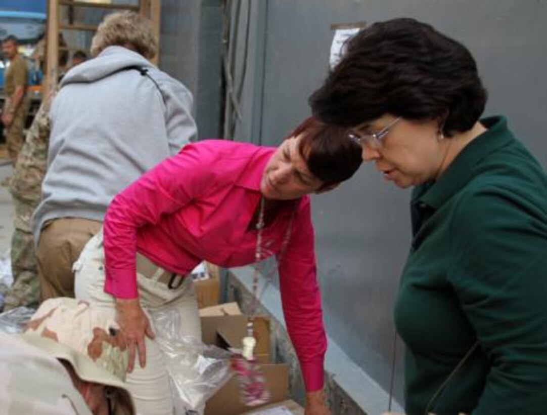 Colleen Shanklin, chairwoman of the Corps of Engineers volunteers and Maria Bock, a TAN member in the engineering branch joined forces with the Volunteer Community Relations (VCR) committee, a volunteer organization from nearby Camp Eggers to prepare two boxes of donated jackets, socks, hats, gloves and other winter clothes Nov. 5. The donations will be delivered to a large orphanage before the holidays. 

The VCR team will make a weekly delivery using armored vehicles. USACE Transatlantic District North employees determined to participate in the program and dubbed their contribution "Operation Warmth."
