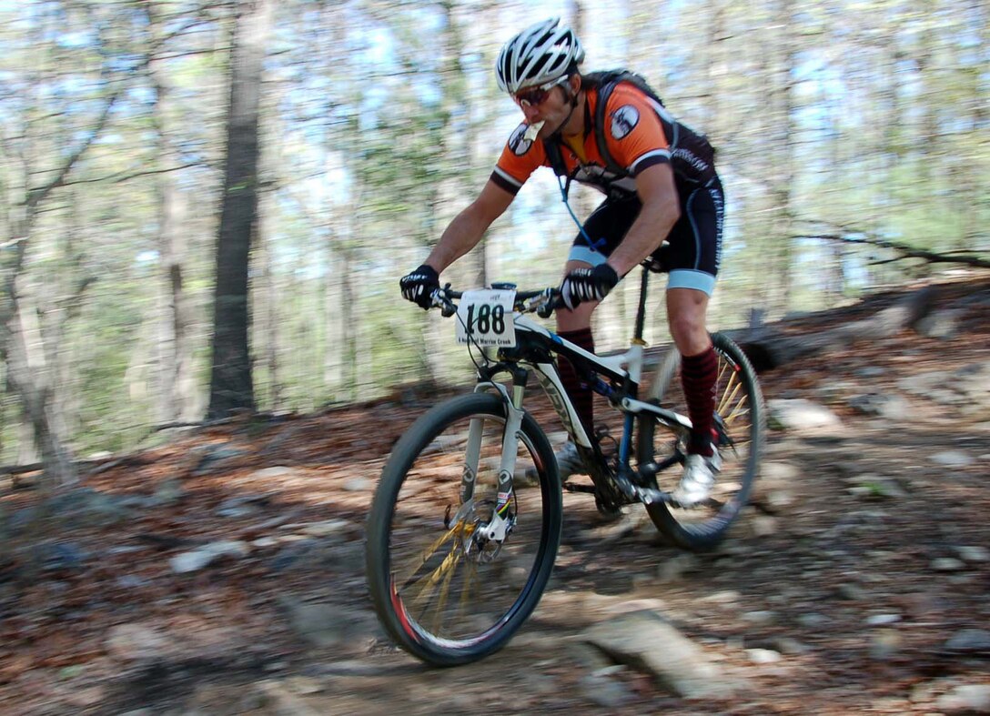 A mountain bicyclist makes his way down an area known as the rock garden at the Warrior Creek mountain bike trail at the Wilmington District's W. Kerr Scott Reservoir near Wilkesboro, North Carolina.  The area has been rated as an "epic trail" by the International Mountain Bike Asscociation.  