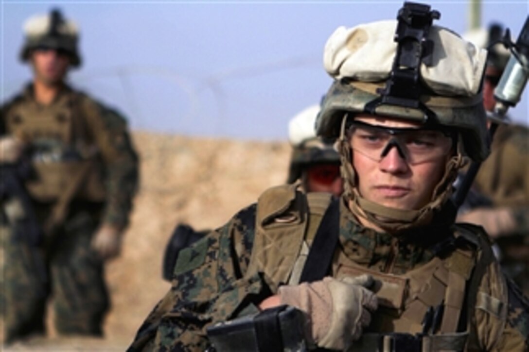 U.S. Marine Lance Cpl. Clinton Rivas patrols through the southern Helmand province of Afghanistan on Nov. 27, 2012.  The patrol teamed with Afghan National Army soldiers and visited an Afghan Police station.  Rivas is a rifleman with Lima Company, 3rd Battalion, 9th Marine Regiment, Regimental Combat Team 7.  