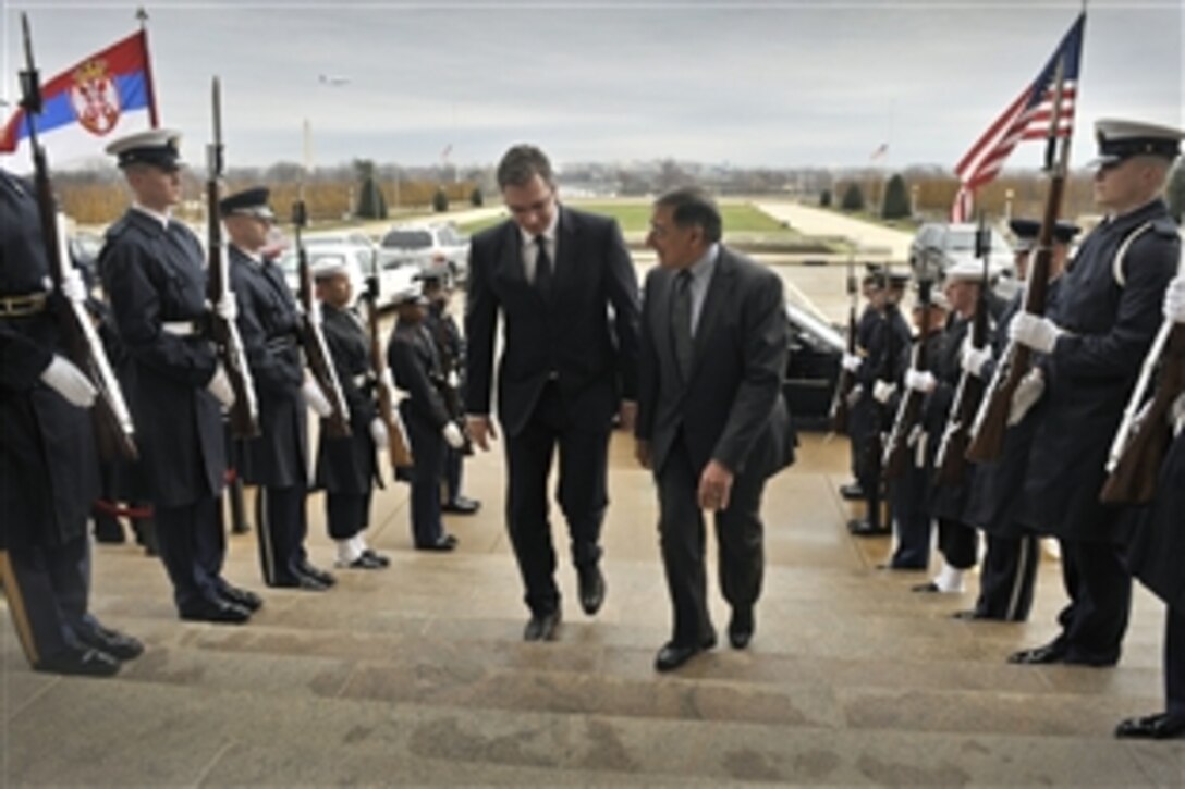 U.S. Defense Secretary Leon E. Panetta hosts an honor cordon to welcome Serbia's Defense Minister Aleksandar Vucic to the Pentagon, Dec. 7, 2012.