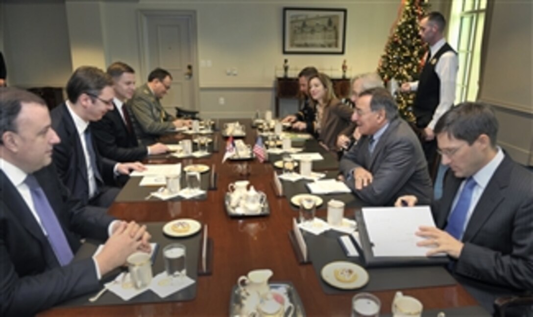 Secretary of Defense Leon E. Panetta, second from right, hosts a meeting with Serbia's Minister of Defense Aleksandar Vucic, second from left, in the Pentagon on Dec. 7, 2012.  Panetta, Vucic and their senior advisors are discussing national and regional security items of interest to both nations.  