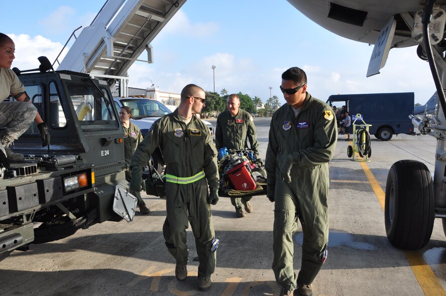 Aeromedical Evacuation crews prepare litters of AE equipment to be loaded on a KC-10 extender at Joint Base Pearl Harbor-Hickam Dec. 3. The Extender is undergoing "proof of principle" missions to determine its capability for supporting combined cargo and aeromedical evacuation missions on Pacific Air Force channels. (U.S. Air Force photo/1st Lt. Angela Martin) 
