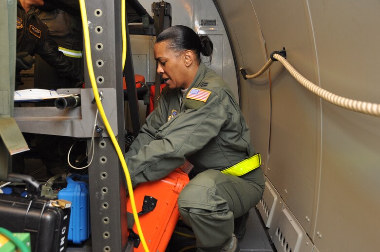 Capt. Brenda White, 43rd Aeromedical Evacuation Squadron flight nurse, secures AE equipment onboard a KC-10 Extender at Travis Air Force Base Dec 2. Inflight kits include about 750 pounds of AE equipment such as heart monitors, frequency converters, litters and oxygen.(U.S. Air Force photo/1st Lt. Angela Martin) 