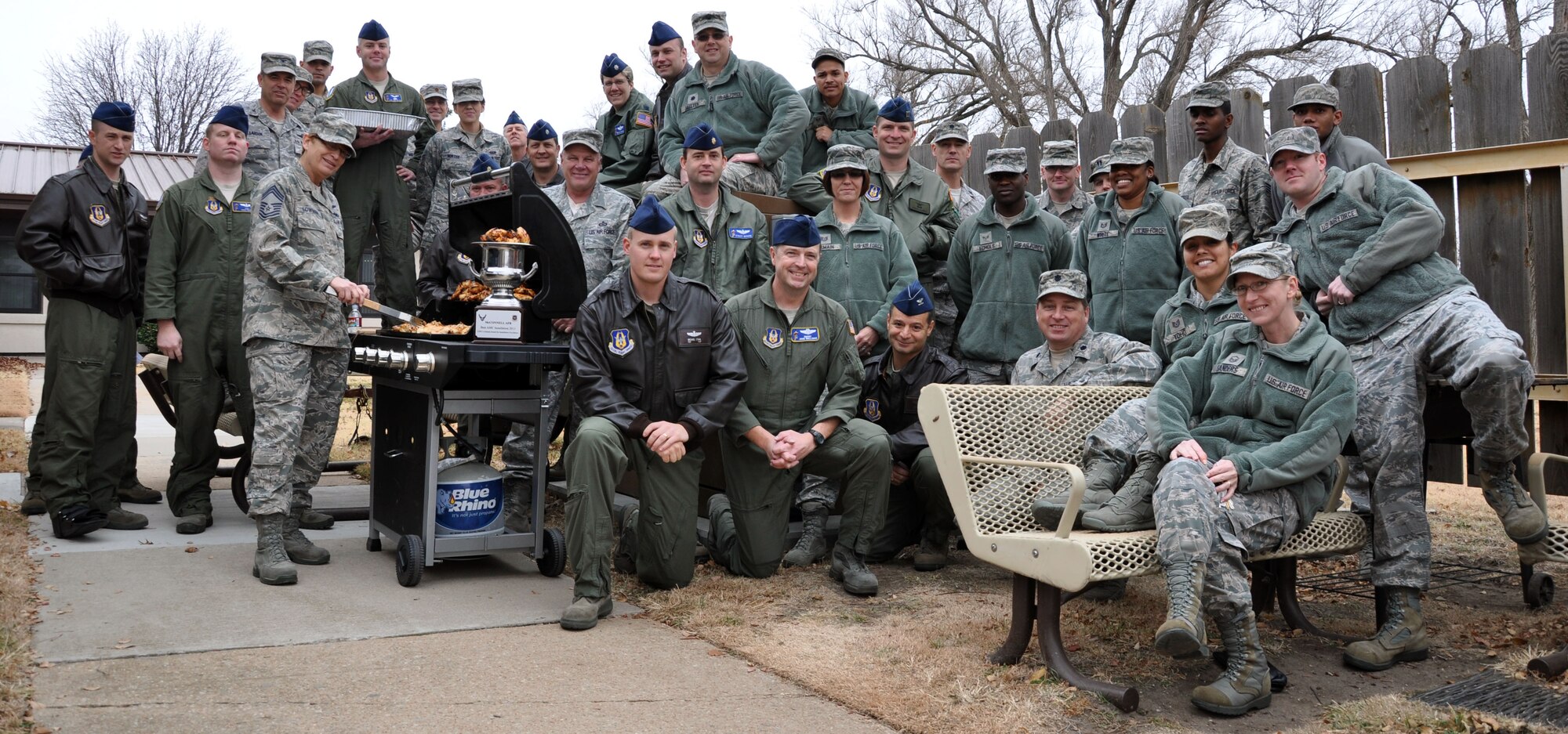 Members of the Air Force Reserve 931st Air Refueling Group's 18th Air Refueling Squadron, 931st Operations Support Squadron, and members of the Group staff pose with the Air Mobility Command Installation Excellence Award Trophy during holiday celebration cookout here, Dec. 8, 2012.  McConnell Air Force Base was named Air Mobility Command's finalist for the 2013 Commander-in Chief's Installation Excellence Award in October, and will be inspected for the overall award in January.  (U.S. Air Force photo by 1st Lt. Zach Anderson)  

