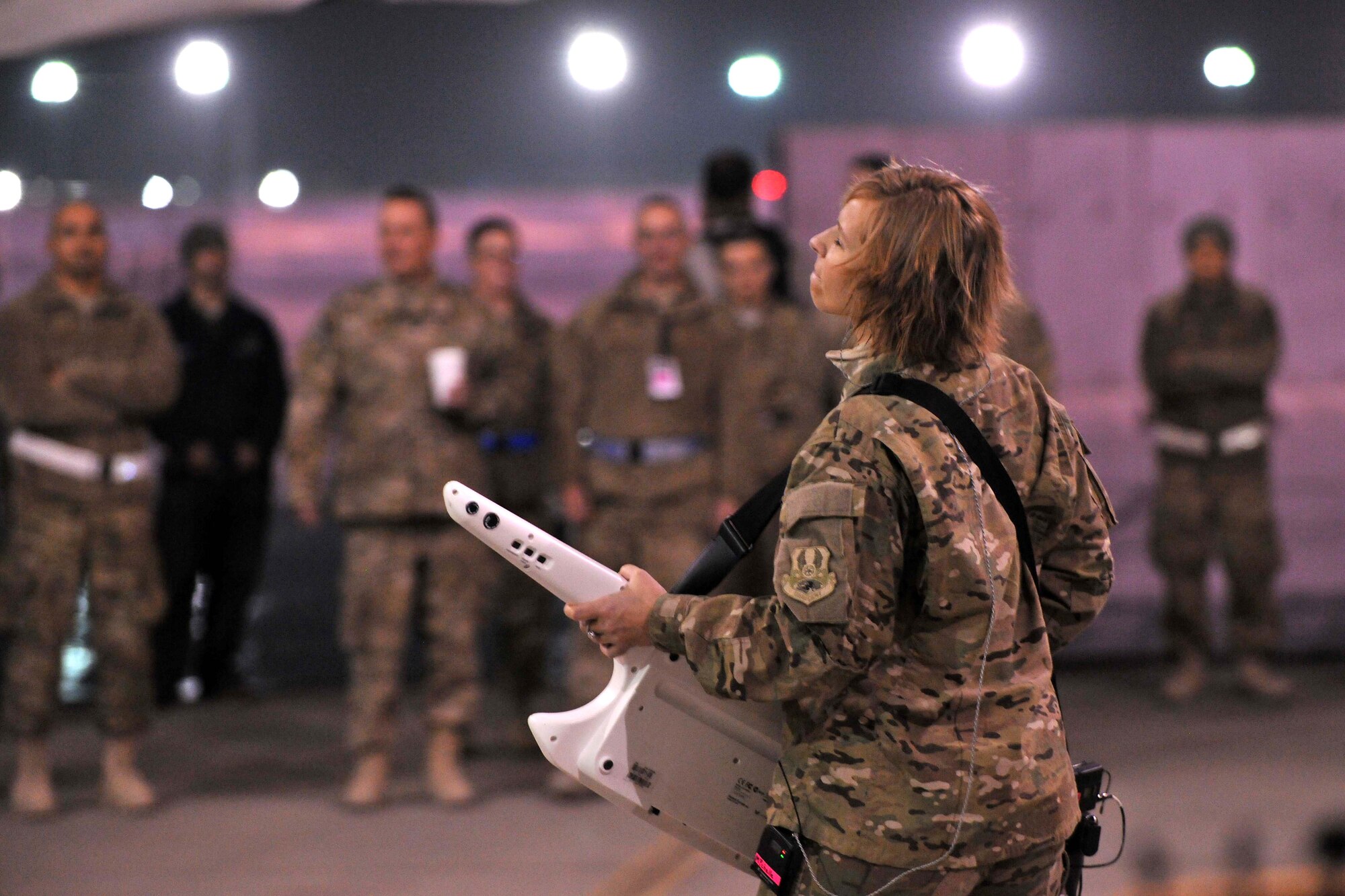 Senior Airman Michelle Hooper, a member of the U.S. Air Forces Central Command Band ensemble Total Force, performs for flightline personnel at Bagram Airfield, Afghanistan, Dec. 7, 2012. USAFCENT band, "Total Force's," flightline performance was the last of three venues in which they played popular hits from the past couple of decades. (U.S. Air Force photo/Senior Airman Chris Willis)