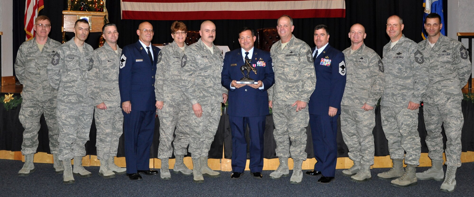 The 931st Air Refueling Group Chief's Group presents a farewell gift to Chief Master Sgt. Robert R. Stephenson during Stephenson's retirement ceremony at McConnell Air Force Base, Kan, Dec. 9, 2012.  Stephenson had served at McConnell Air Force Base since 1995, and was the Group's first Maintenance Superintendent for the Deputy Commander for Maintenance staff.  The chief had served in the Air Force for more than 35 years.  (U.S. Air Force photo by 1st Lt. Zach Anderson)