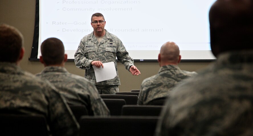 Senior Master Sgt. Todd Wadkins with the 932nd Airlift Wing Safety office, discusses express mentoring, which Wadkins calls the "speed dating" technique, as a way to conduct performance feedback and mentoring. The training was held during a professional development class Dec. 9, at Scott Air Force Base, Ill., and the development classes are held twice each quarter. (U.S. Air Force photo/Tech. Sgt. Christopher Parr)