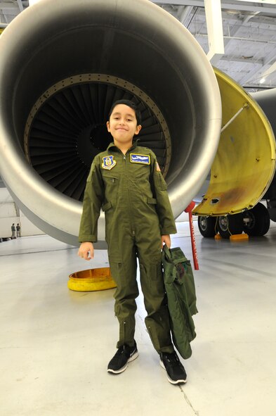 JOINT BASE ANDREWS, Md. -- Melvin Maldonado,10,  poses for a photo outside a KC-135 Stratotanker from the 459th Air Refueling Wing during Team Andrew's Pilot for a Day program here Dec. 7, 2012. The Pilot for a Day program is coordinated through the Air Force Reserve Command's 459th ARW and the District of Columbia Air National Guard's 113th Wing. Pilot for a Day or "P4D" is a community outreach program that allows military and civilian children of all ages who suffer from serious or chronic medical conditions to visit an installation for the day to tour wing and base facilities. (U.S. Air Force photo/Tech Sgt Steve Lewis)