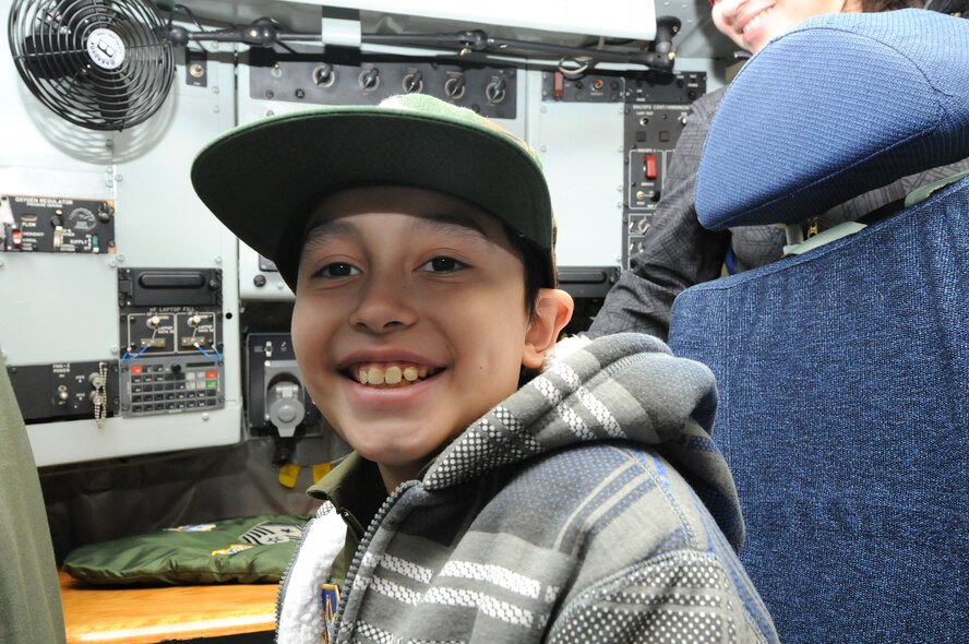 JOINT BASE ANDREWS, Md. -- Melvin Maldonado,10,  poses for a photo aboard a KC-135 Stratotanker from the 459th Air Refueling Wing during Team Andrew's Pilot for a Day program here Dec. 7, 2012. The Pilot for a Day program is coordinated through the Air Force Reserve Command's 459th ARW and the District of Columbia Air National Guard's 113th Wing. Pilot for a Day or "P4D" is a community outreach program that allows military and civilian children of all ages who suffer from serious or chronic medical conditions to visit an installation for the day to tour wing and base facilities. (U.S. Air Force photo/Tech Sgt Steve Lewis)