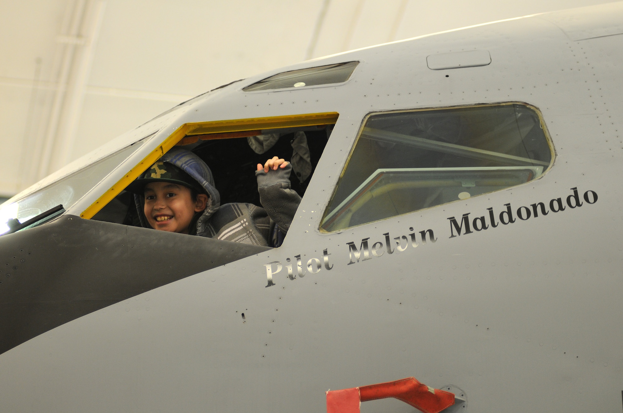 JOINT BASE ANDREWS, Md. -- Melvin Maldonado, 10, enjoys the view from the cockpit of a  KC-135 Stratotanker from the 459th Air Refueling Wing during Team Andrew's Pilot for a Day program here Dec. 7, 2012. Coordinated through the Air Force Reserve Command's 459th ARW and the District of Columbia Air National Guard's 113th Wing, Pilot for a Day or "P4D" is a community outreach program that allows military and civilian children of all ages who suffer from serious or chronic medical conditions to visit an installation for the day to tour wing and base facilities. (U.S. Air Force photo/Tech Sgt Steve Lewis)