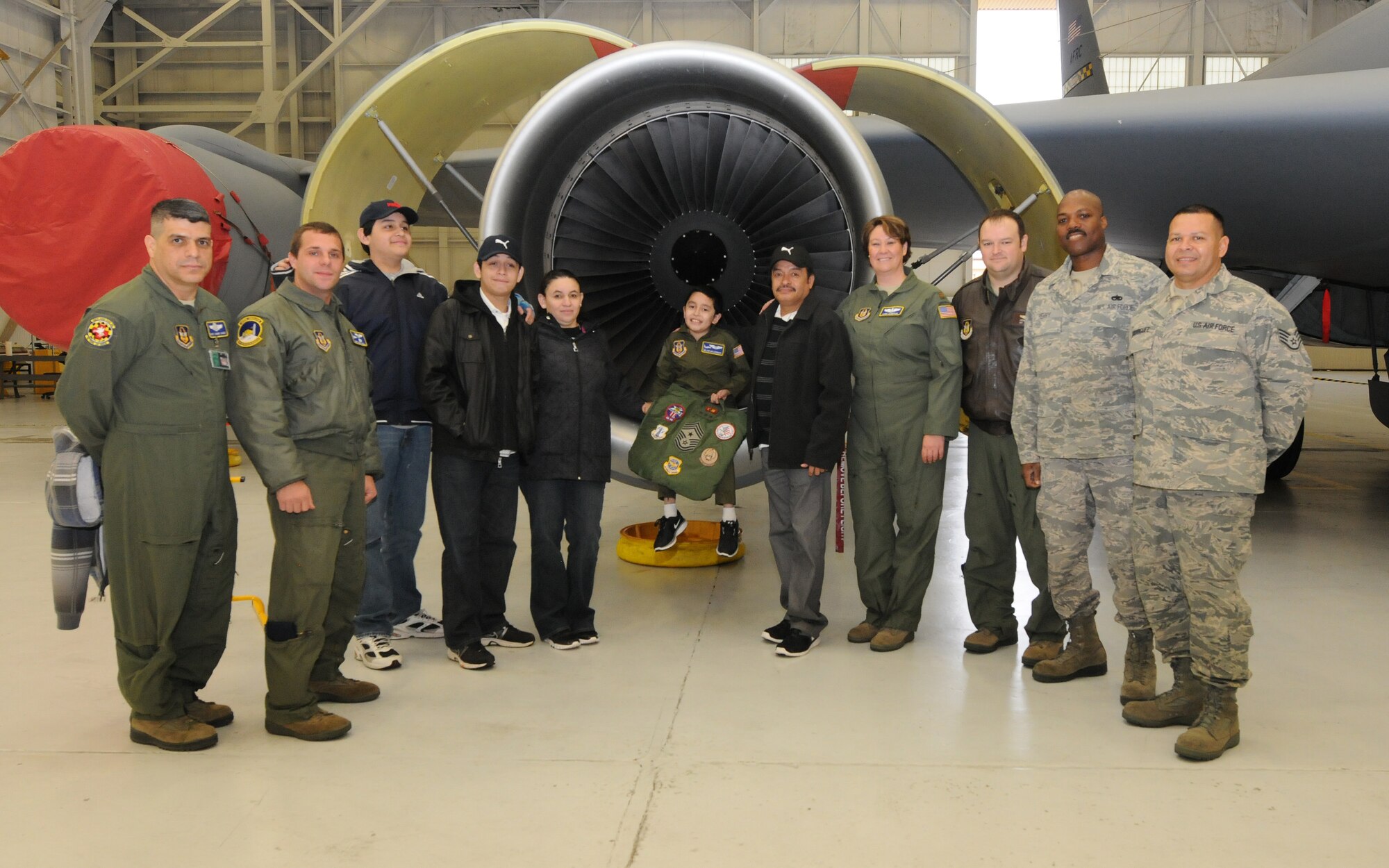 JOINT BASE ANDREWS, Md. -- Melvin Maldonado, 10, poses for a group photo after touring a KC-135 Stratotanker from the 459th Air Refueling Wing during Team Andrew's Pilot for a Day program here Dec. 7, 2012. Coordinated through the Air Force Reserve Command's 459th ARW and the District of Columbia Air National Guard's 113th Wing, Pilot for a Day or "P4D" is a community outreach program that allows military and civilian children of all ages who suffer from serious or chronic medical conditions to visit an installation for the day to tour wing and base facilities. (U.S. Air Force photo/Tech Sgt Steve Lewis)