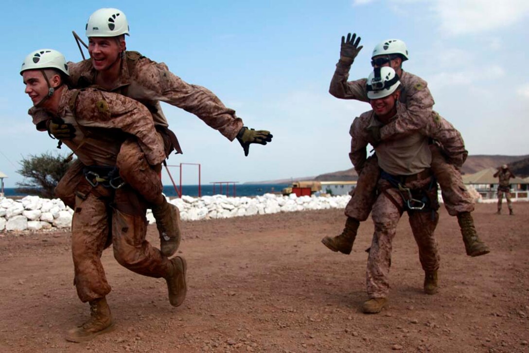 Marines and sailors with Battalion Landing Team 3/5, 15th Marine Expeditionary Unit, race against each other during a team-building obstacle course at the French Combat Warfare Training Center in Djibouti, Dec. 4. The training, led by instructors from French forces of the French CWTC in Djibouti, involved obstacle courses on land and in the water different from ones Marines and sailors are used to seeing back home. The 15th MEU is deployed as part of the Peleliu Amphibious Ready Group as a U.S. Central Command theater reserve force, providing support for maritime security operations and theater security cooperation efforts in the U.S. 5th Fleet area of responsibility. (U.S. Marine Corps photo by Cpl. John Robbart III)