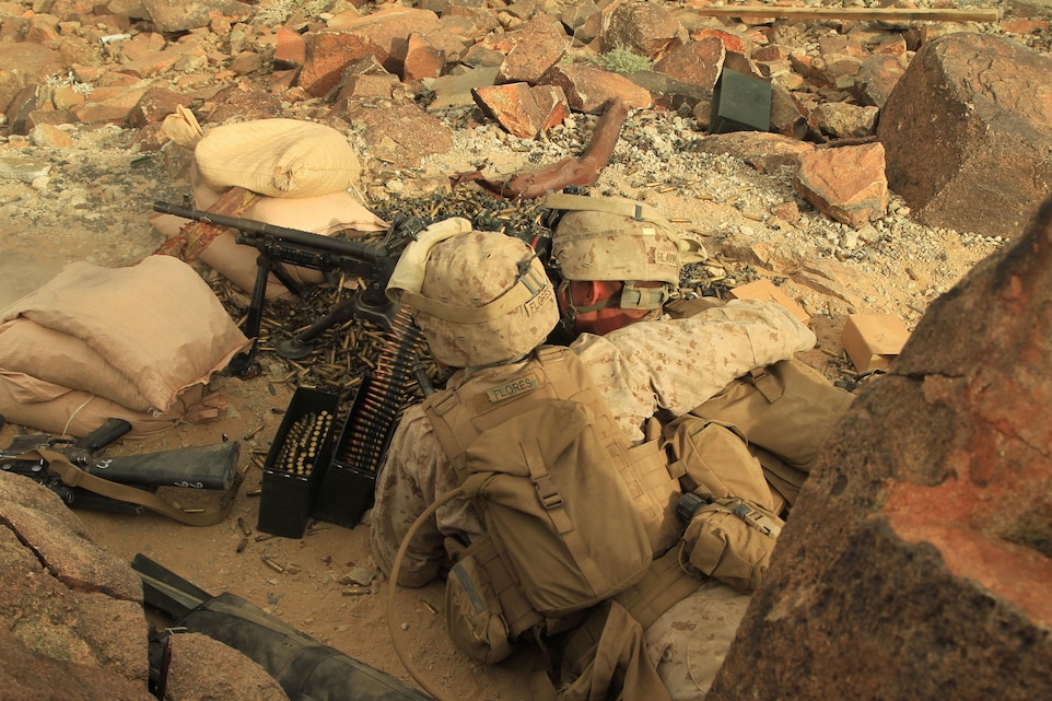 Machine gunners with Company B, 1st Battalion, 4th Marine Regiment, lay down suppressive fire at Range 410 during a platoon-sized combined arms live fire-maneuver exercise during Exercise Steel Knight 2013. 1/4 is participating in 1st Marine Division’s largest combined arms live fire-maneuver exercise.