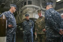 USS BATAAN - Brig. Gen. Blake Crowe, deputy commander, Marine Corps Forces Command, discusses the USS Bataan's (LHD-5) capabilities with (from left to right) CAPT. Timothy Spratto, commodore, Amphibious Squadron Six, CAPT George Vassilakis, executive officer, USS Bataan (LHD-5) and CAPT. Erik Ross, commanding officer, USS Bataan (LHD-5). Crowe toured the USS Bataan to see firsthand its current capabilities and some of the ship's improvements as a result of the Naval Amphibious Baseline Initiative.