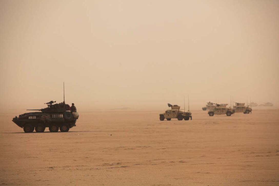 U.S. Marines assigned to Battalion Landing Team 3/5, 15th Marine Expeditionary Unit (MEU), stage vehicles near Camp Buehring, Kuwait, during exercise Eager Mace 13, Nov. 19. The U.S. Navy and Marine Corps participated in the bilateral training exercise with the Kuwait Armed Forces to expand levels of cooperation, enhance mutual maritime capabilities and promote long-term regional stability and interoperability between U.S. forces and regional partners. The 15th MEU is deployed with the Peleliu Amphibious Ready Group as a U.S. Central Command theater reserve force, providing support for maritime security operations and theater security cooperation efforts in the U.S. 5th Fleet area of responsibility. (U.S. Marine Corps photo by Cpl. Timothy R. Childers/Released)