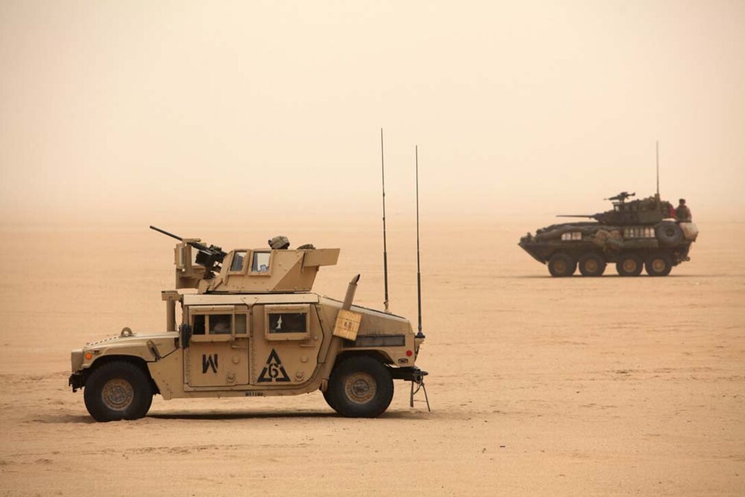 U.S. Marines assigned to Battalion Landing Team 3/5, 15th Marine Expeditionary Unit (MEU), stage vehicles near Camp Buehring, Kuwait, during exercise Eager Mace 13, Nov. 19. The U.S. Navy and Marine Corps participated in the bilateral training exercise with the Kuwait Armed Forces to expand levels of cooperation, enhance mutual maritime capabilities and promote long-term regional stability and interoperability between U.S. forces and regional partners. The 15th MEU is deployed with the Peleliu Amphibious Ready Group as a U.S. Central Command theater reserve force, providing support for maritime security operations and theater security cooperation efforts in the U.S. 5th Fleet area of responsibility. (U.S. Marine Corps photo by Cpl. Timothy R. Childers/Released)